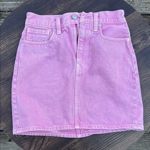 The cutest light-washed, pink, denim mini skirt. Perfect for a pop of color.